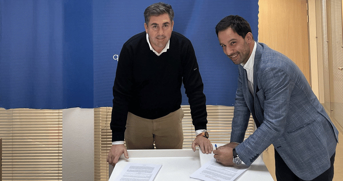 Two persons signing a document